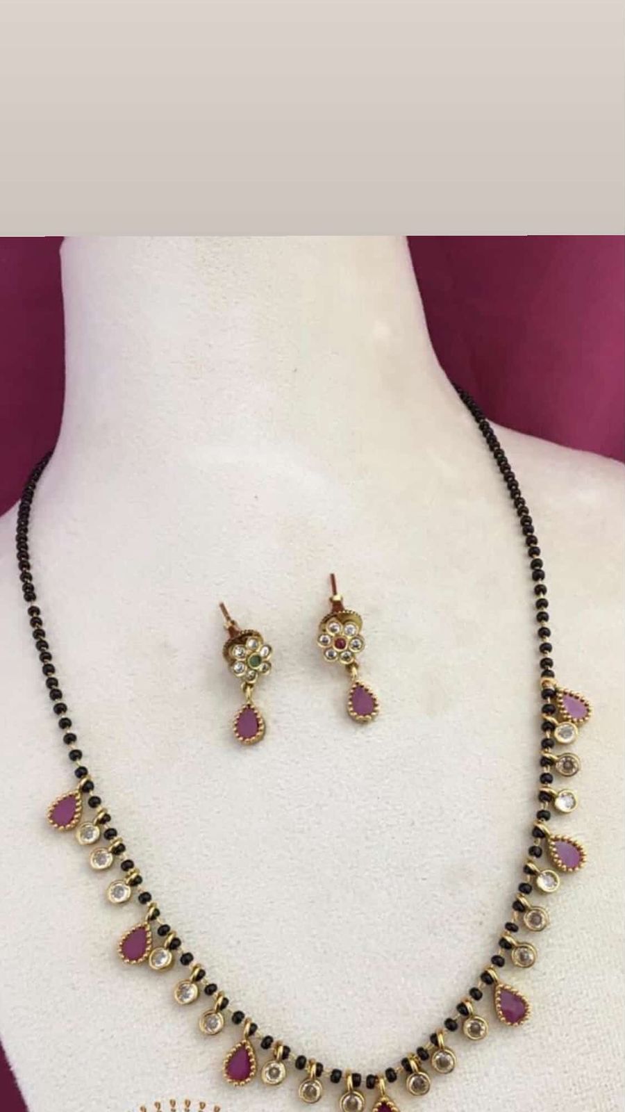 Karimani with rain drop ruby white stone set